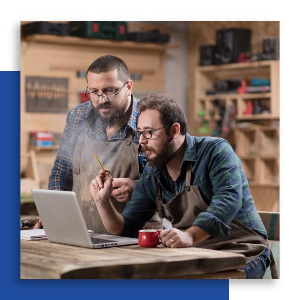 two men with laptop small business it support